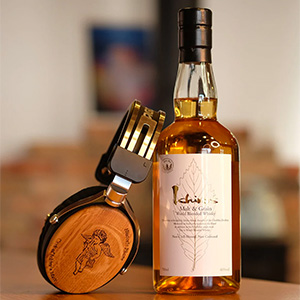 Tago Studio Historic Phone Cask of Ichiro's Malt: headphones leaning against a bottle of Ichiro's Malt whisky